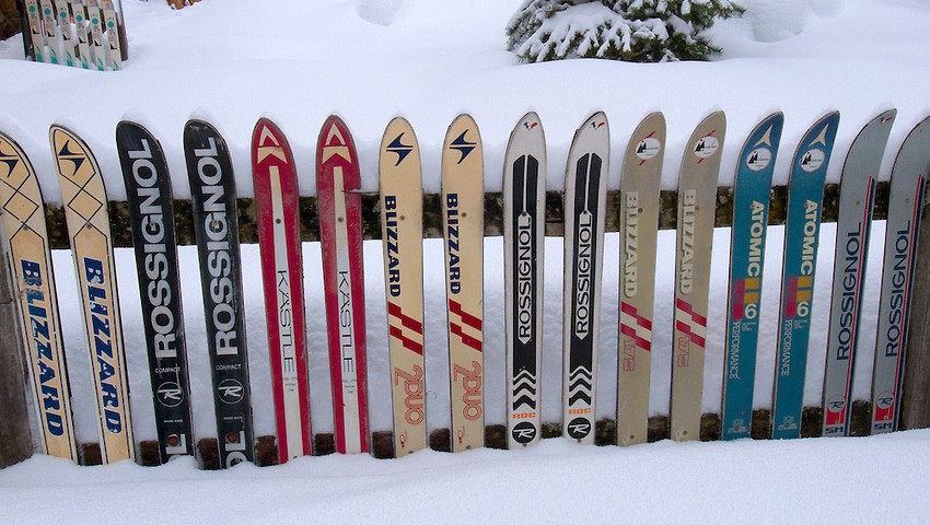 Sarreyer. Wooden Alpine chalet. Old skis. Snow.
